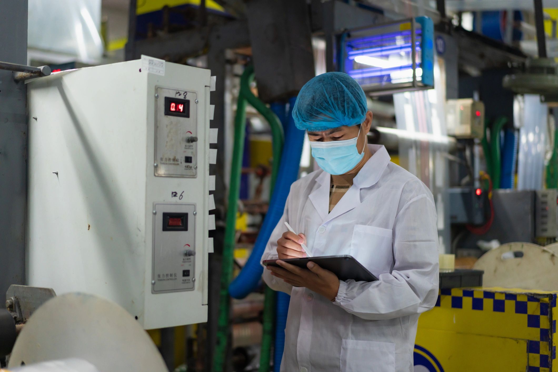 Factory manager checking production